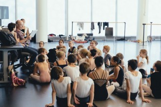 Appointed Rehearsal Master André Laprise with young dancers
