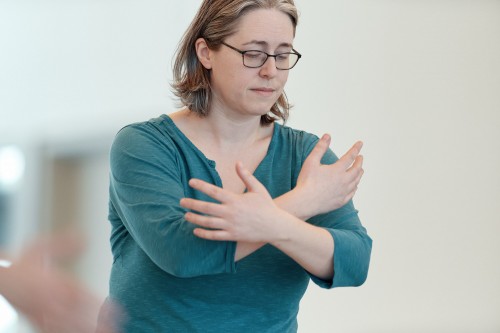A woman participates in a dance therapy class